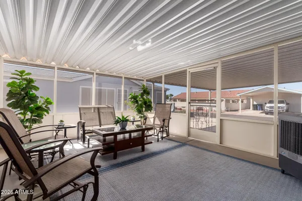 a outdoor room with chairs