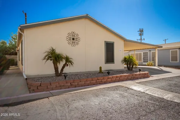 a view of a house with a backyard and windows