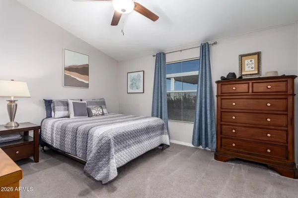 a bedroom with a bed and a dresser