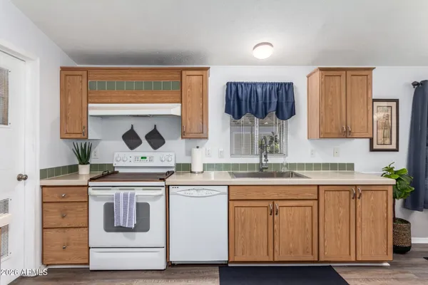 a kitchen with a stove and cabinets