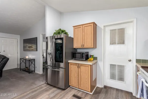 a kitchen with stainless steel appliances a refrigerator and a stove top oven