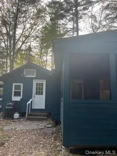 a backyard of a house with seating space