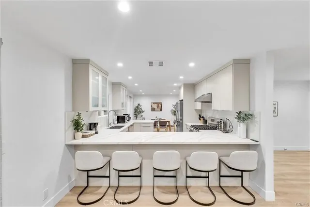 a kitchen with a table and chairs in it