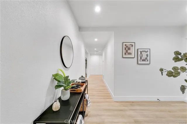 a dining room with furniture and a potted plant