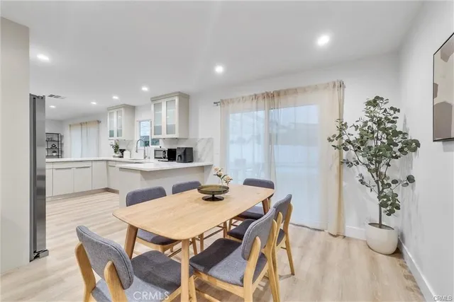 a kitchen with a table and chairs in it