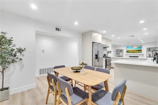 a kitchen with a table and chairs in it