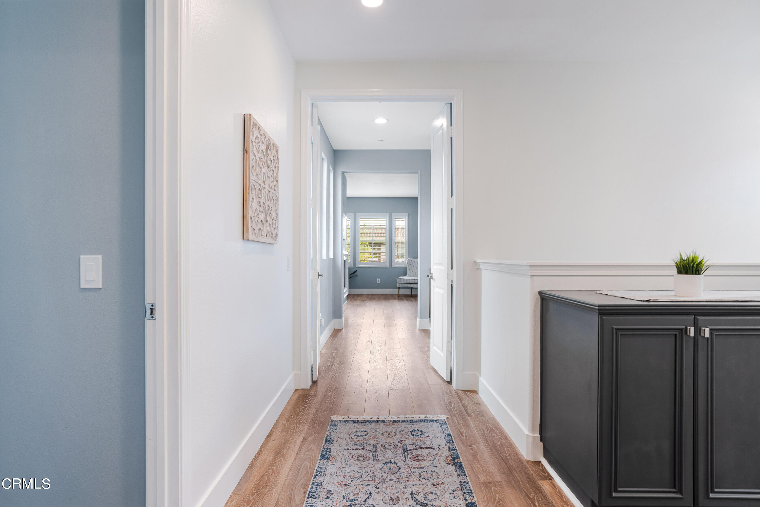 1404 Donegal Way Oxnard, CA 93035 - Photo 25 of 51 a view of a hallway with wooden floor and a bathroom