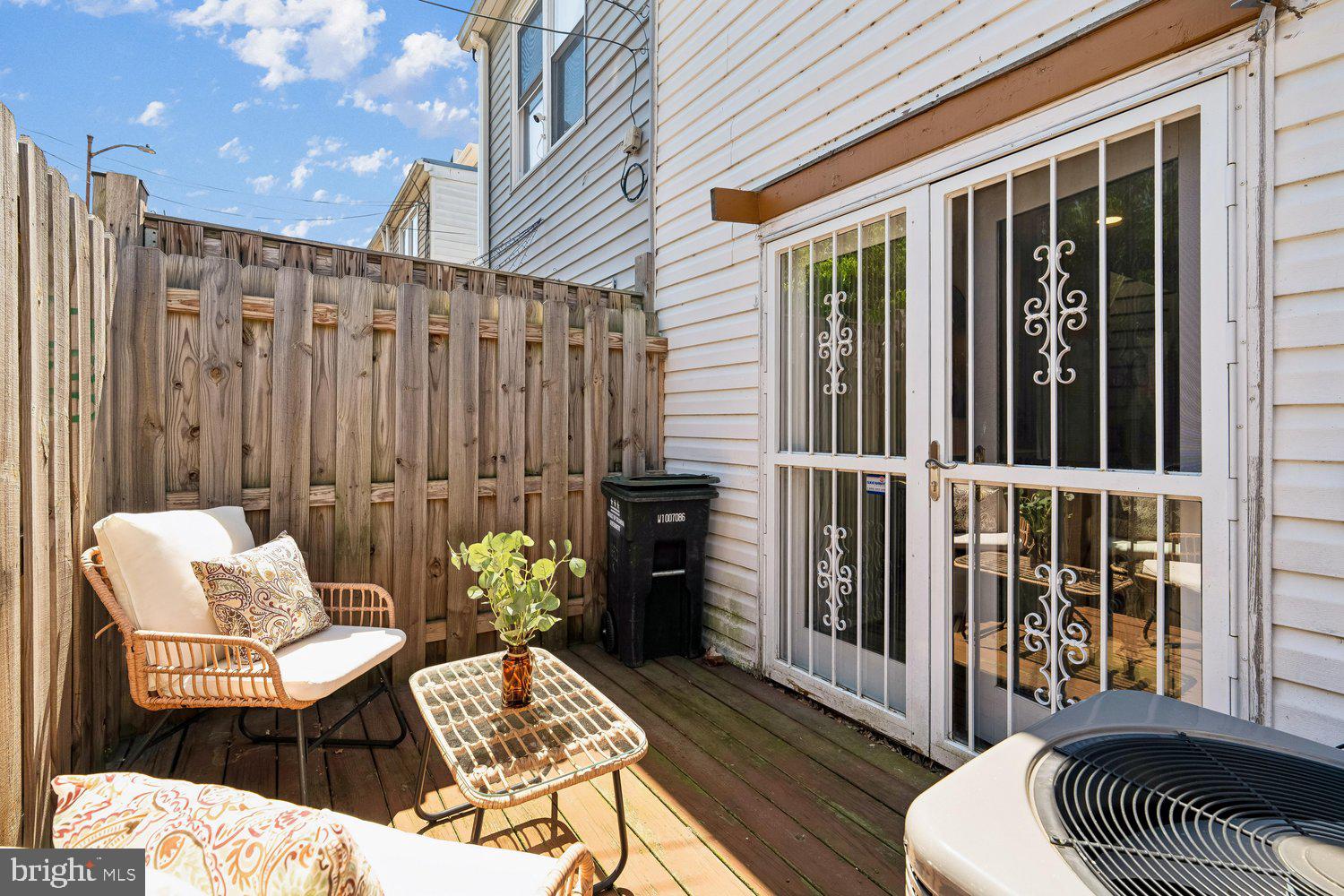 1652 Kramer Street Northeast Washington, DC 20002 - Photo 23 of 26 a balcony with furniture and wooden floor