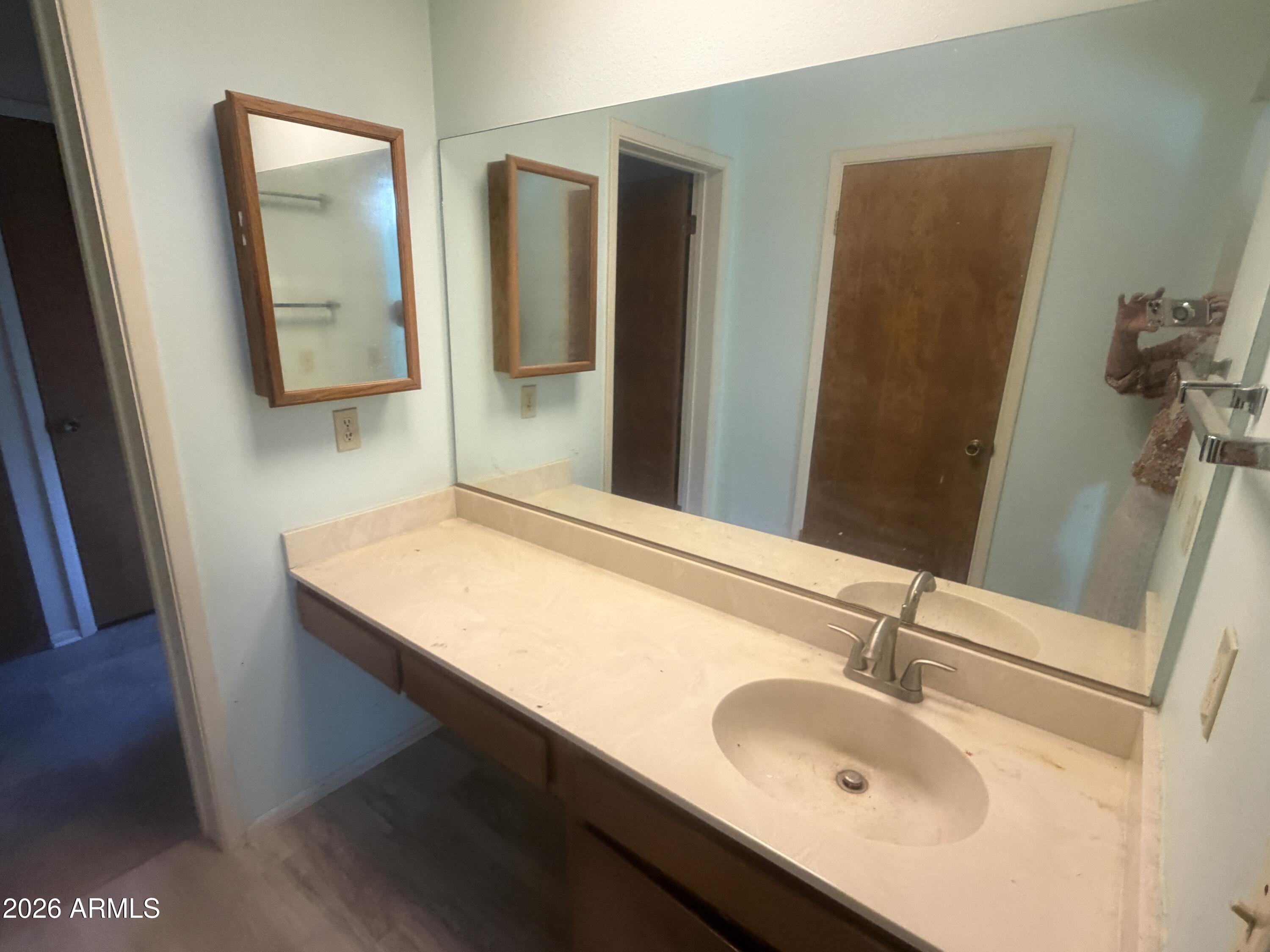 3255 East Rimrock Drive Rimrock, AZ 86335 - Photo 12 of 18 a bathroom with a sink and a mirror