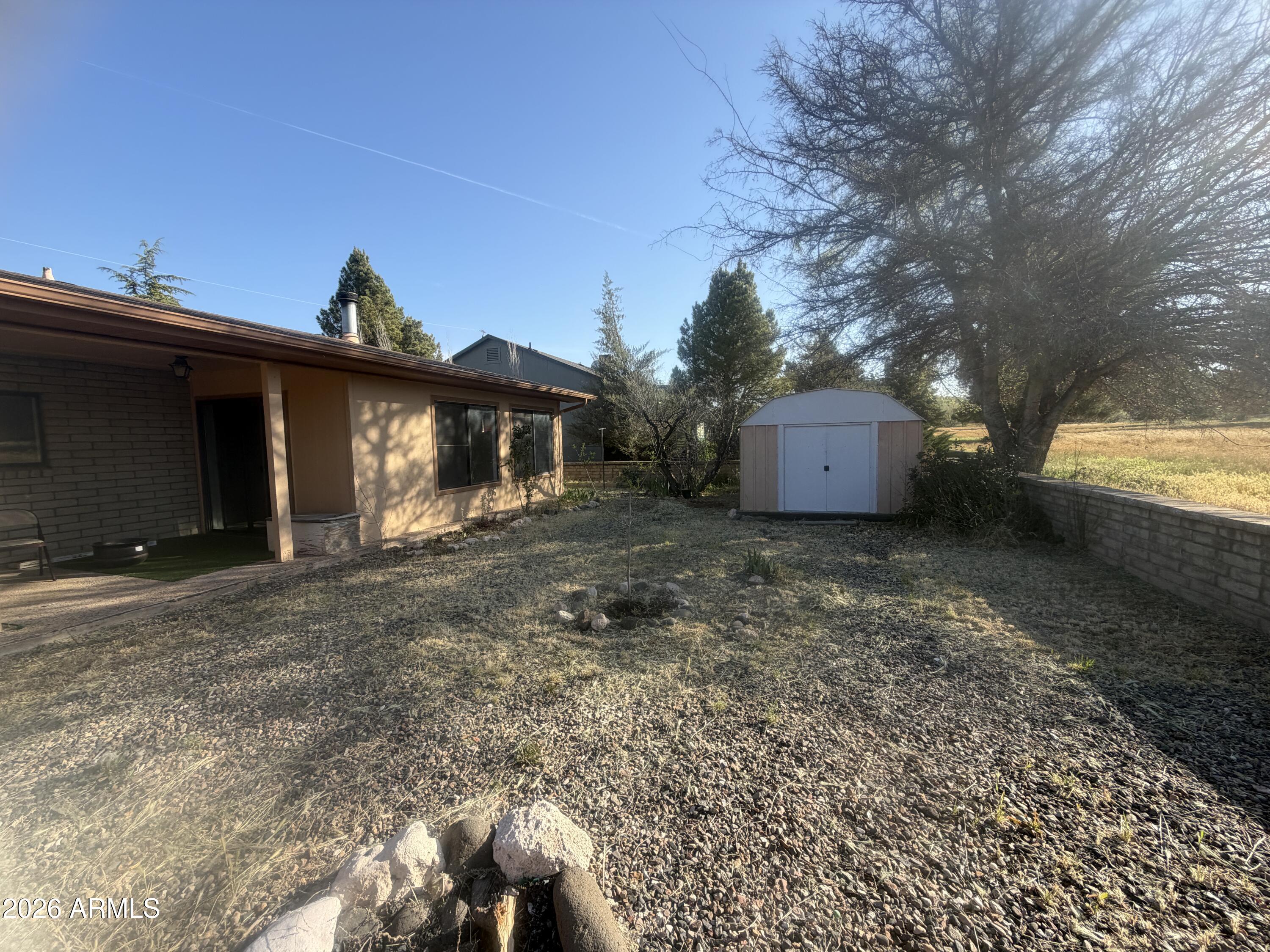 3255 East Rimrock Drive Rimrock, AZ 86335 - Photo 17 of 18 a view of a house with a yard and a garage