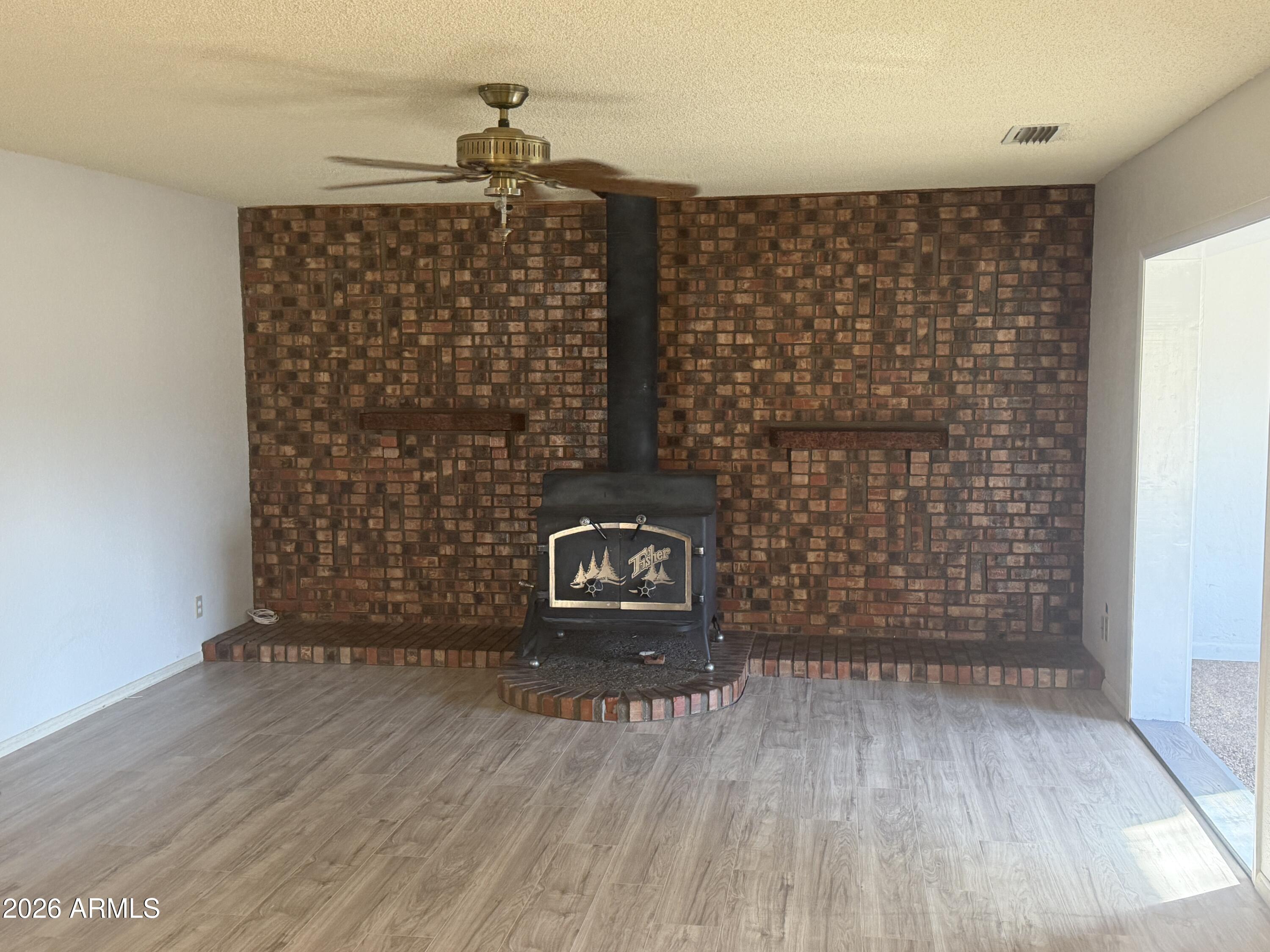 3255 East Rimrock Drive Rimrock, AZ 86335 - Photo 4 of 18 a view of wooden floor with utility