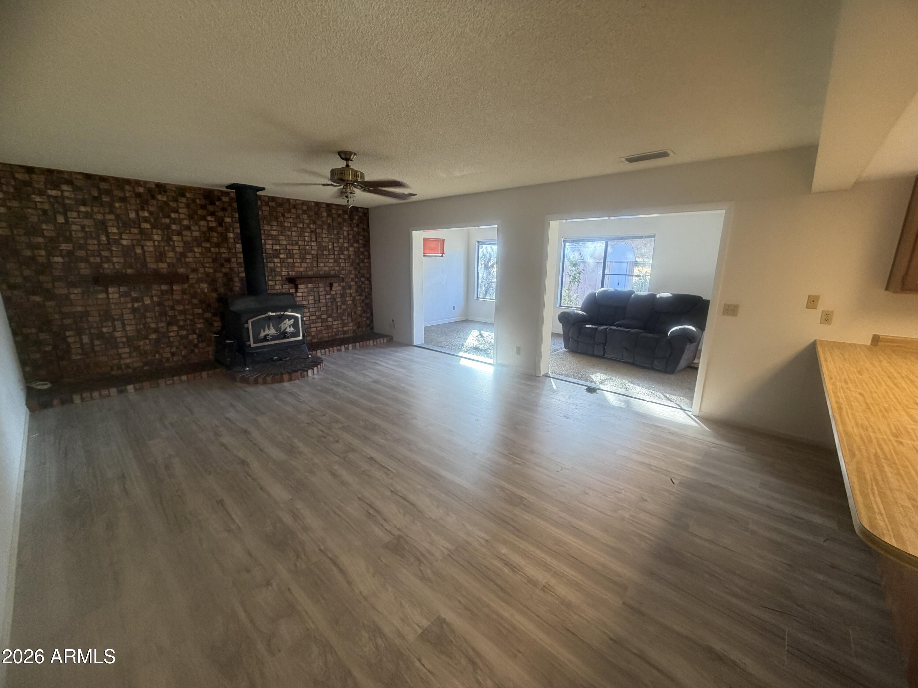 3255 East Rimrock Drive Rimrock, AZ 86335 - Photo 5 of 18 a living room with furniture and a chandelier