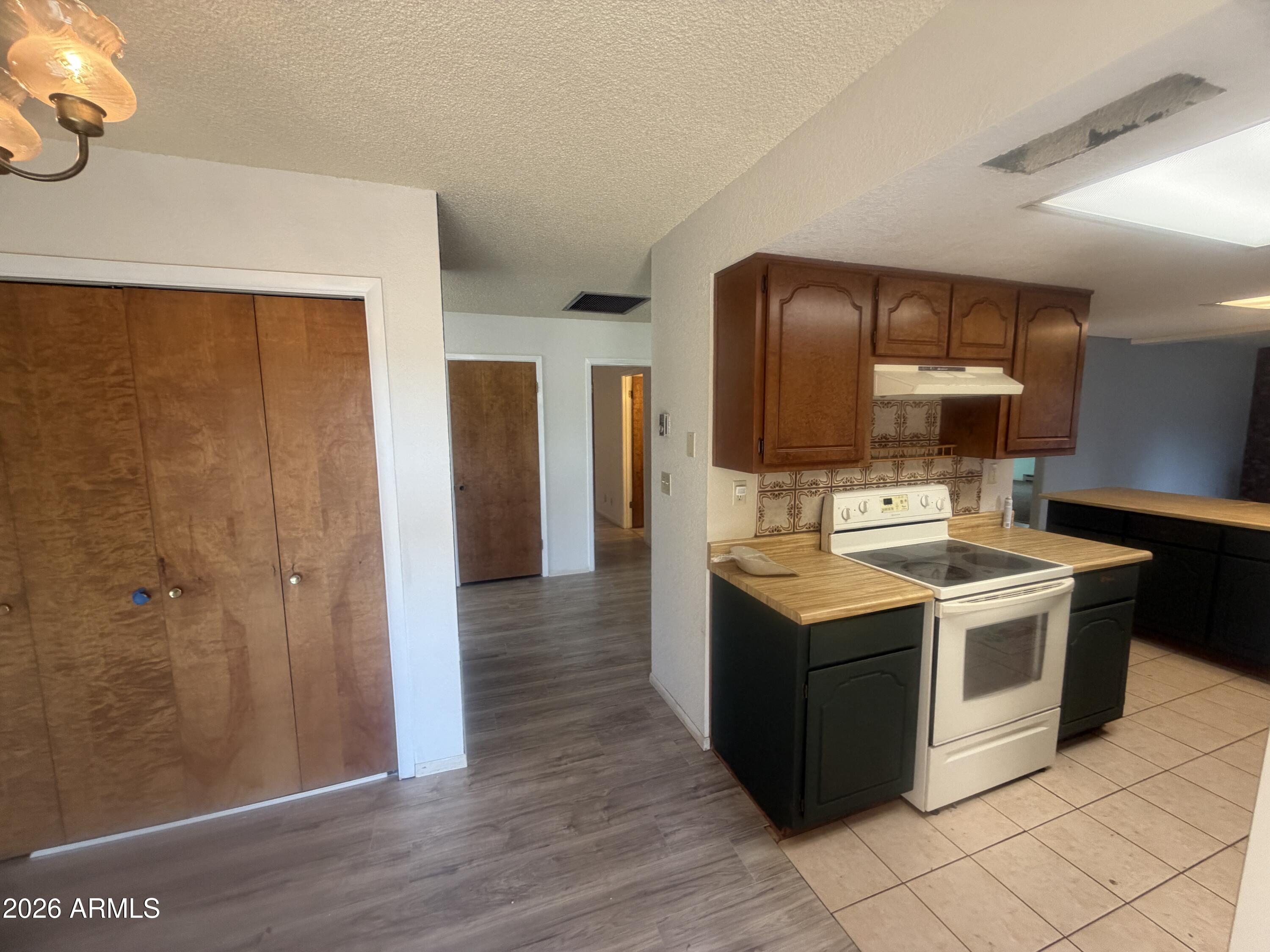 3255 East Rimrock Drive Rimrock, AZ 86335 - Photo 9 of 18 a kitchen with stainless steel appliances granite countertop a stove and a refrigerator
