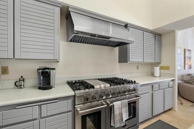 a kitchen with a stove and a sink