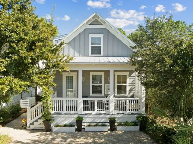 a front view of a house with a garden