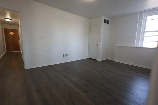 a kitchen with a refrigerator and a stove top oven