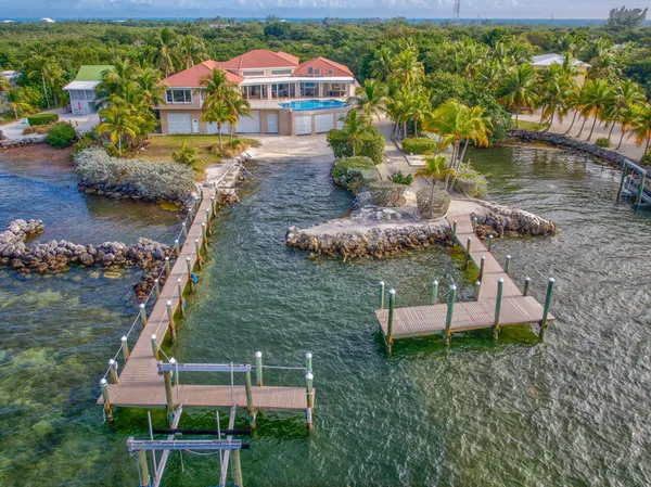 an aerial view of a house with a lake view