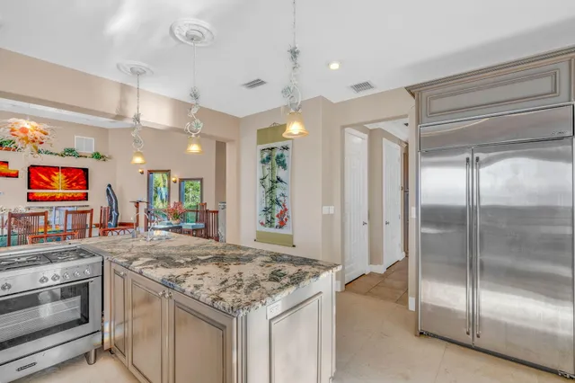 a bed room with a bed and a chair