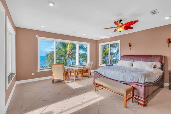 a bed room with a bed and a chair