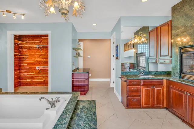 a kitchen with stainless steel appliances granite countertop a sink and a cabinets