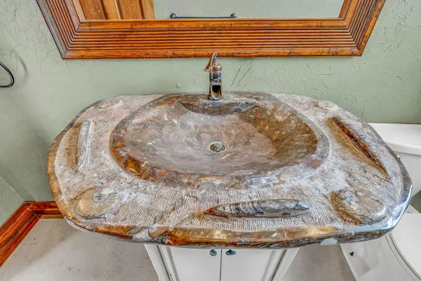 a aerial view of a house with a yard table and chairs