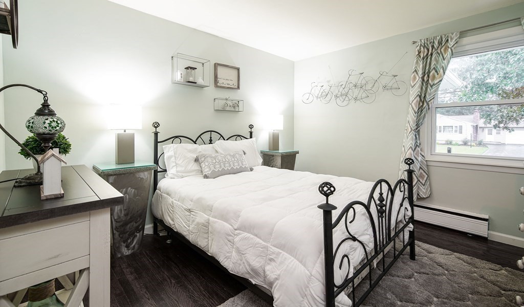 148 Glenoak Drive Springfield, MA 01129 - Photo 16 of 28 a bedroom with a bed and a table