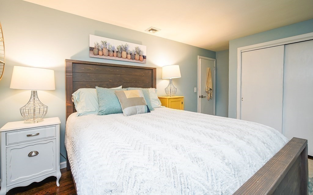 148 Glenoak Drive Springfield, MA 01129 - Photo 17 of 28 a bedroom with a bed and a night stand