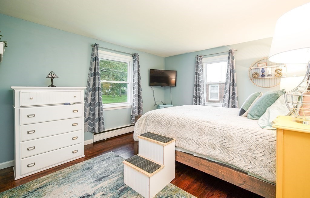 148 Glenoak Drive Springfield, MA 01129 - Photo 18 of 28 a bedroom with a bed and a flat screen tv