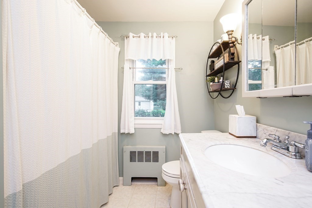 148 Glenoak Drive Springfield, MA 01129 - Photo 19 of 28 a bathroom with a sink and a mirror