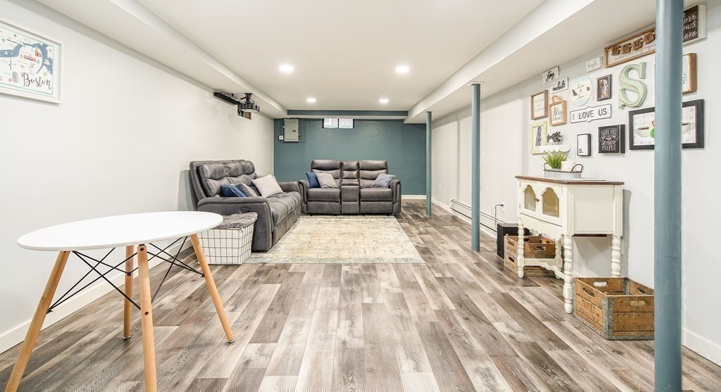 148 Glenoak Drive Springfield, MA 01129 - Photo 22 of 28 a living room with furniture and a wooden floor