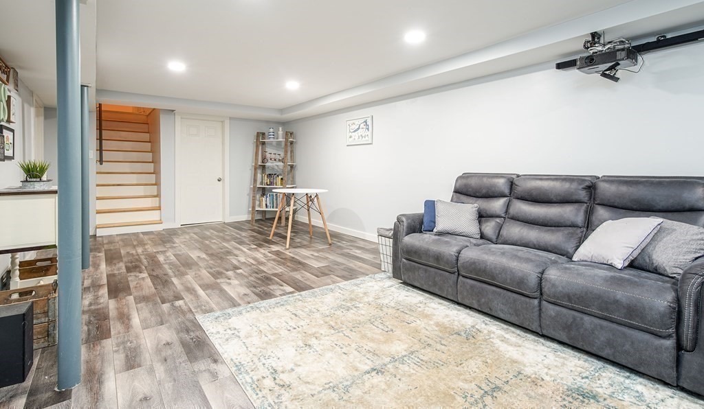 148 Glenoak Drive Springfield, MA 01129 - Photo 23 of 28 a living room with furniture and a flat screen tv