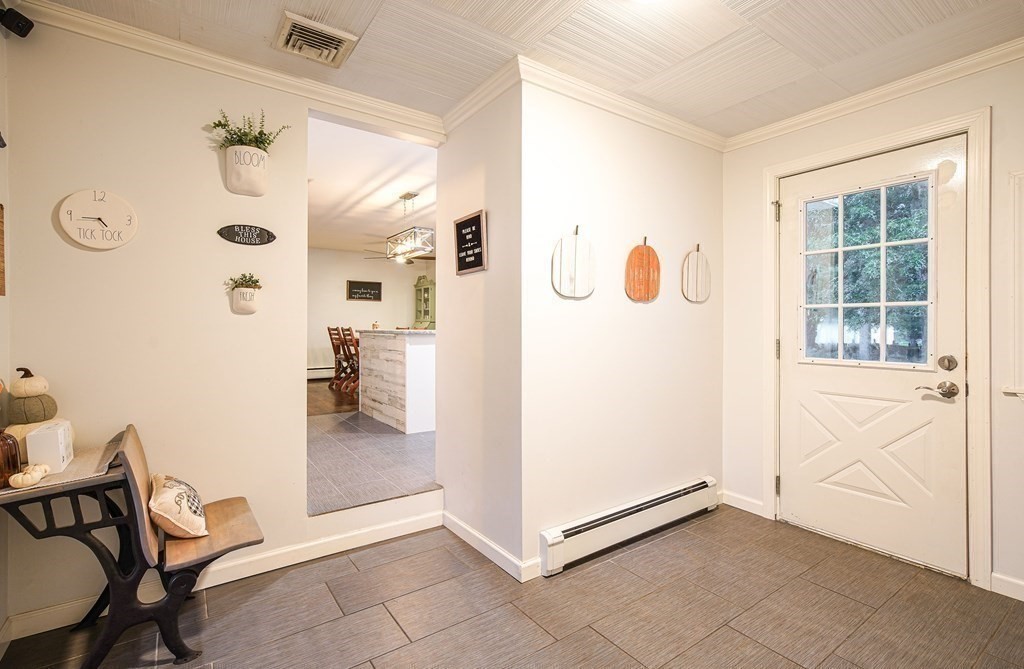 148 Glenoak Drive Springfield, MA 01129 - Photo 5 of 28 a view of a livingroom with wooden floor and a refrigerator