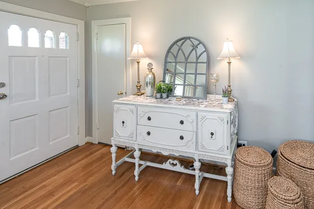 a view of a livingroom with furniture and wooden floor