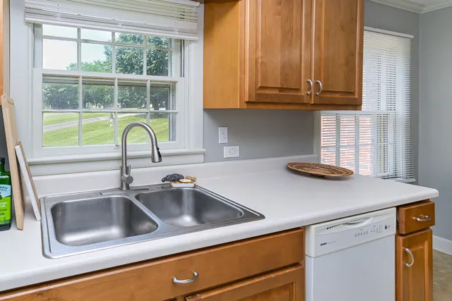 a kitchen with a sink and a window