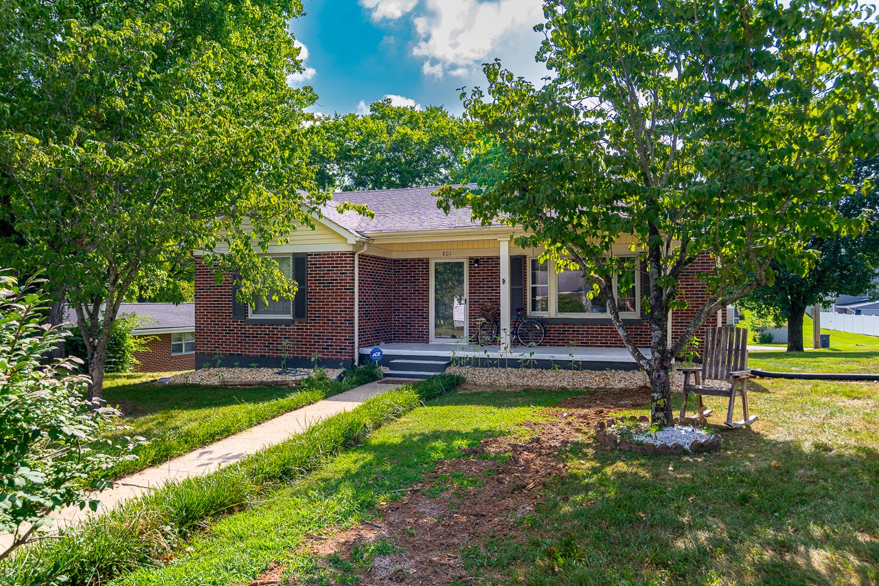 801 2nd Avenue Fayetteville, TN 37334 - Photo 2 of 41 a view of a house with swimming pool and a yard