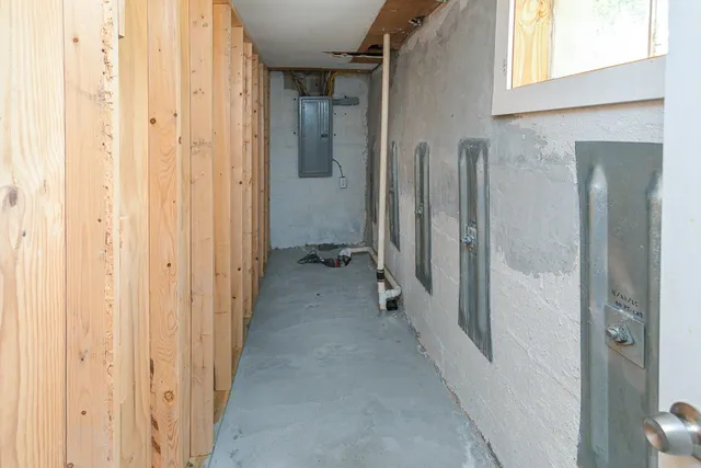 a view of a hallway with a wooden door