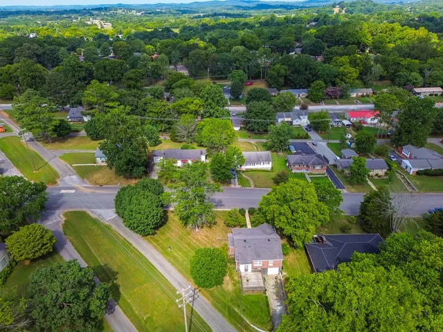 an aerial view of house with yard