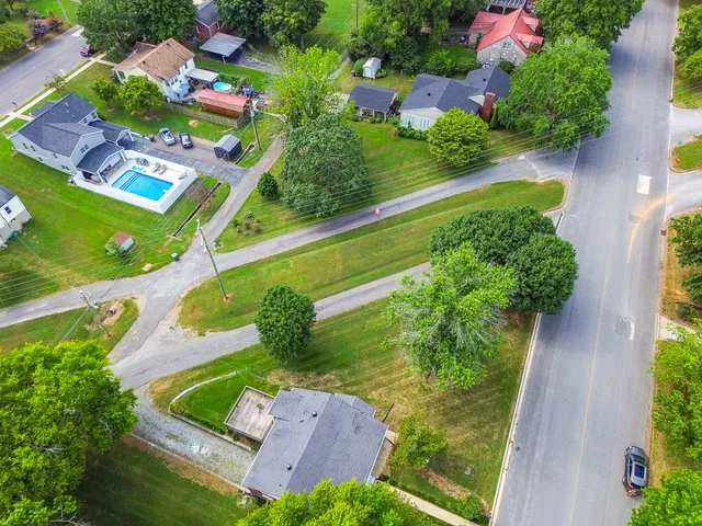 an aerial view of a house with a garden