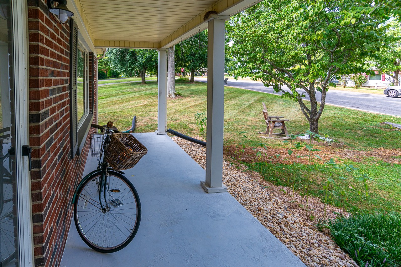 801 2nd Avenue Fayetteville, TN 37334 - Photo 5 of 41 a view of a patio with a table chairs and a backyard