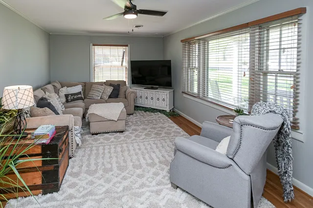 a living room with furniture and a flat screen tv