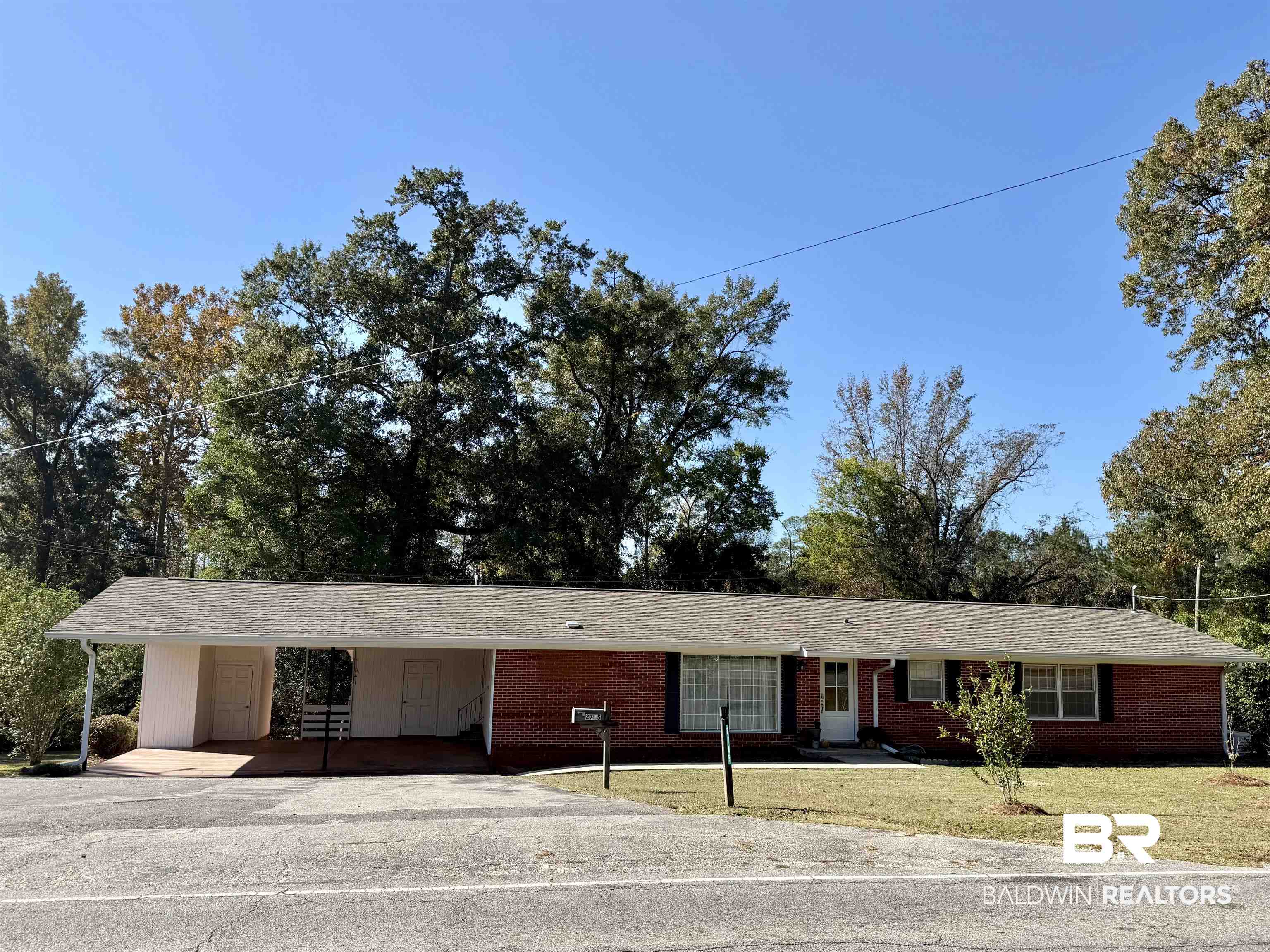 2785 Appleton Road Brewton, AL 36426 - Photo 28 of 28 Single story home featuring asphalt driveway, a carport, brick siding, and a front lawn