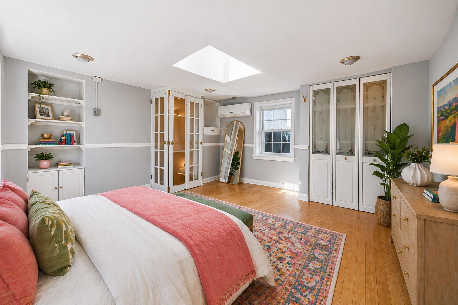 2834 Edgemont Street Philadelphia, PA 19134 - Photo 13 of 37 a spacious bedroom with a bed and wooden floor