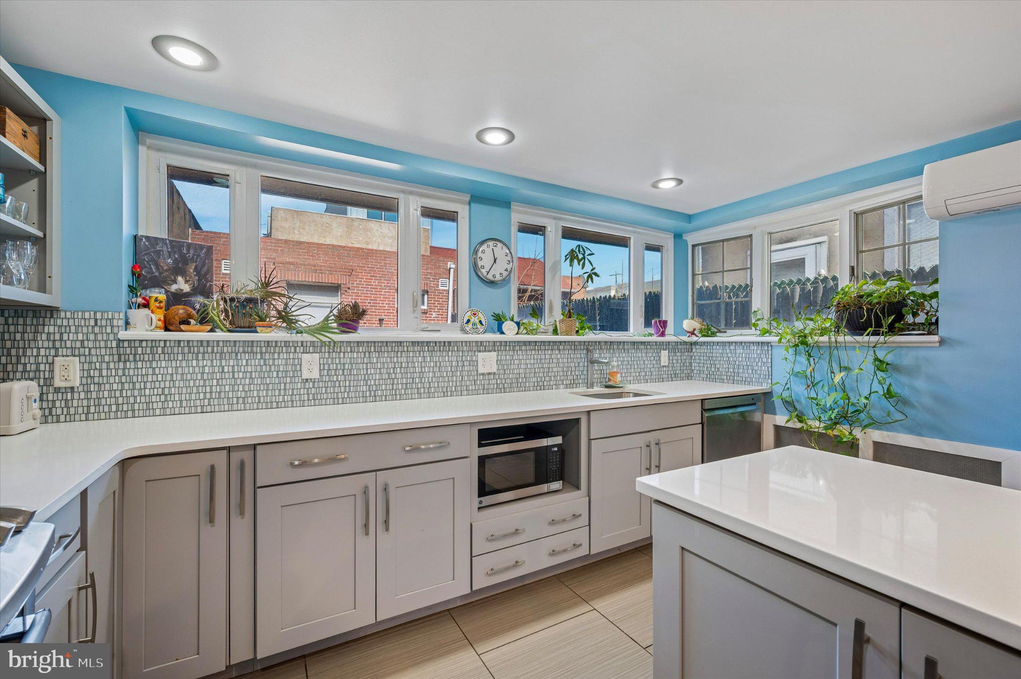 2834 Edgemont Street Philadelphia, PA 19134 - Photo 14 of 37 a kitchen with a sink stove and cabinets
