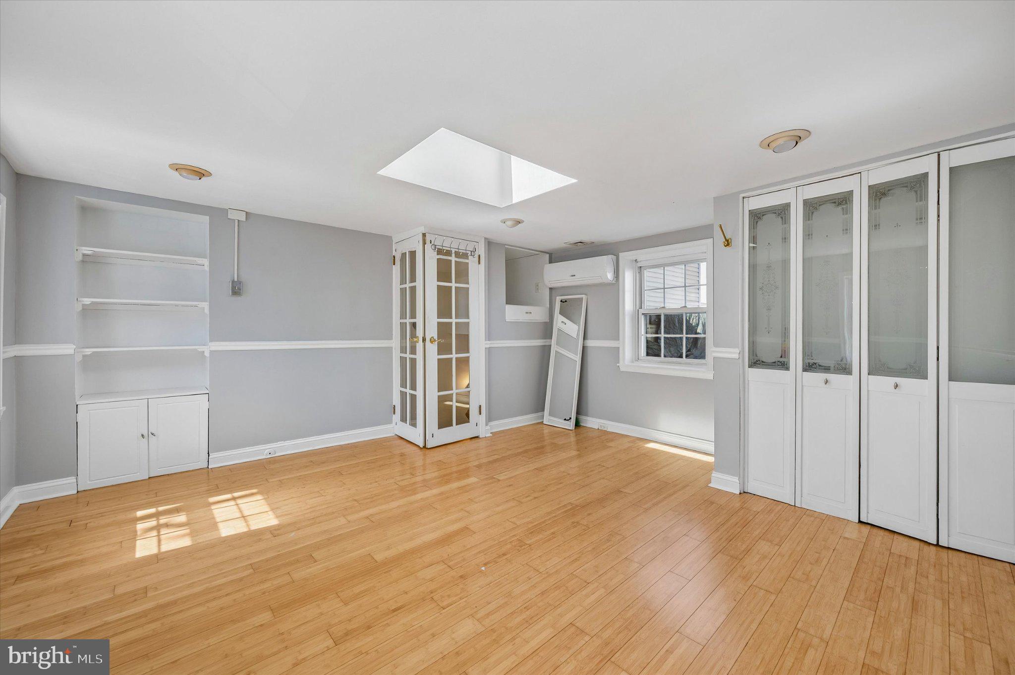 2834 Edgemont Street Philadelphia, PA 19134 - Photo 19 of 37 a view of an empty room with a window and wooden floor