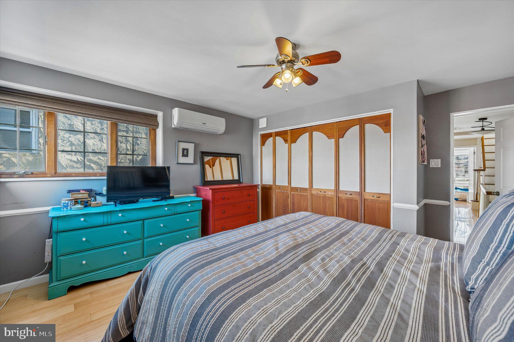 2834 Edgemont Street Philadelphia, PA 19134 - Photo 19 of 37 a bedroom with a bed and a chandelier