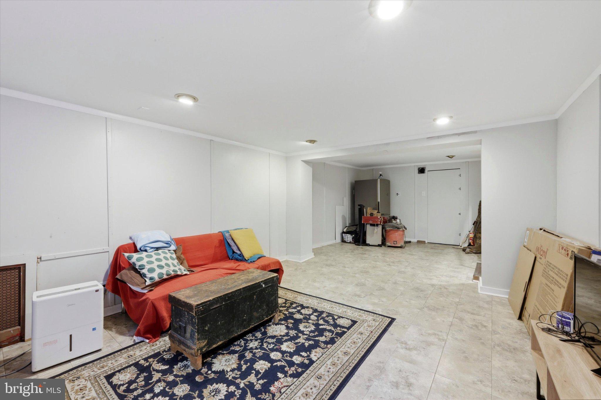2834 Edgemont Street Philadelphia, PA 19134 - Photo 32 of 37 a living room with furniture gym equipment and a couch