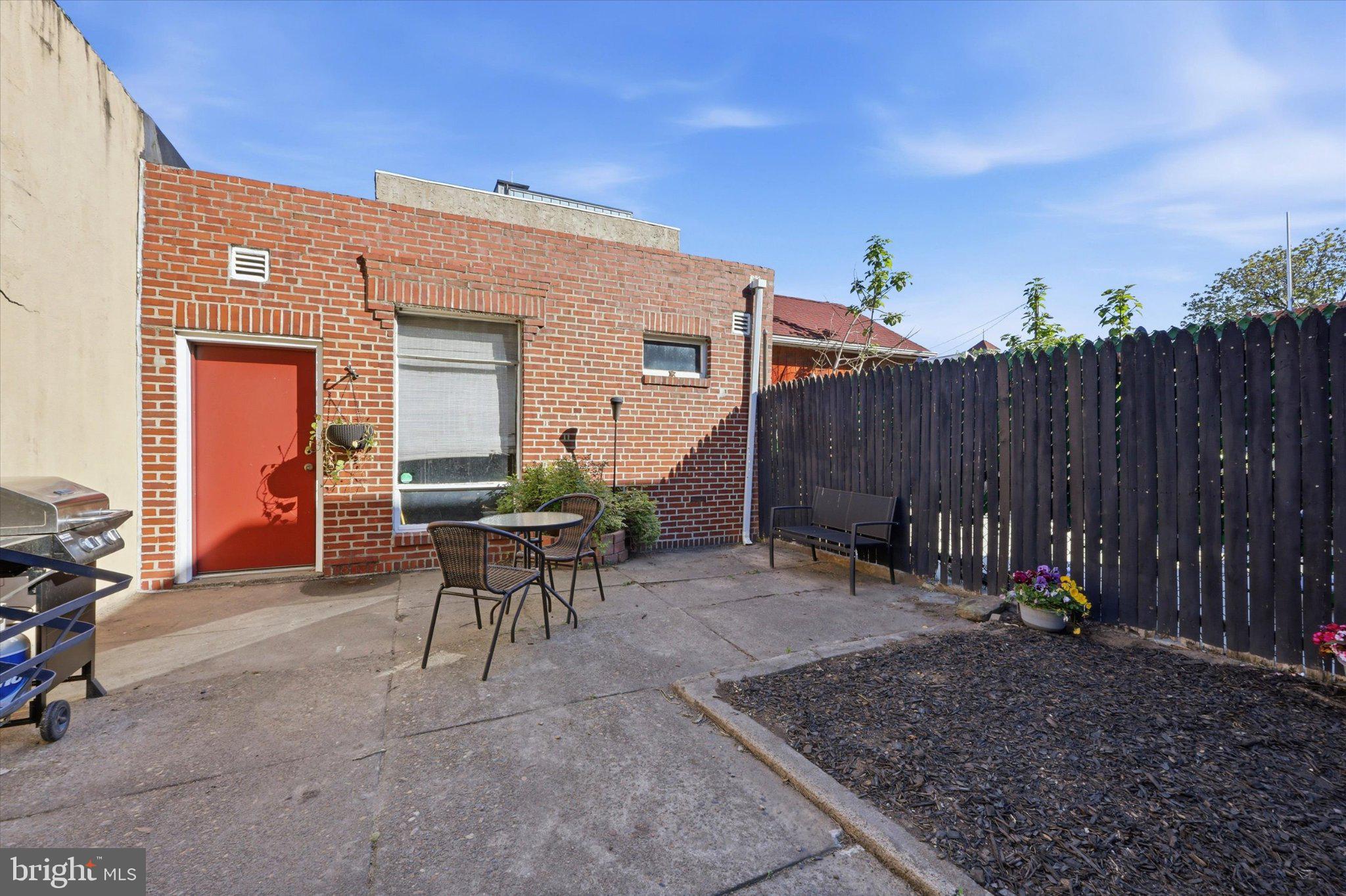 2834 Edgemont Street Philadelphia, PA 19134 - Photo 6 of 37 a view of backyard with a table and chairs