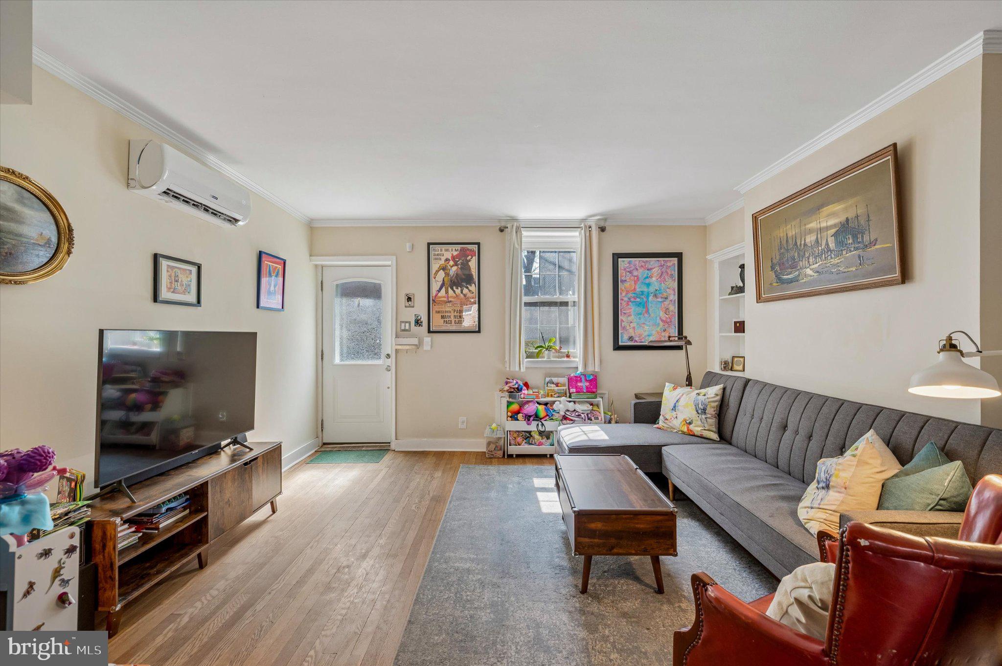 2834 Edgemont Street Philadelphia, PA 19134 - Photo 10 of 37 a living room with furniture and a flat screen tv
