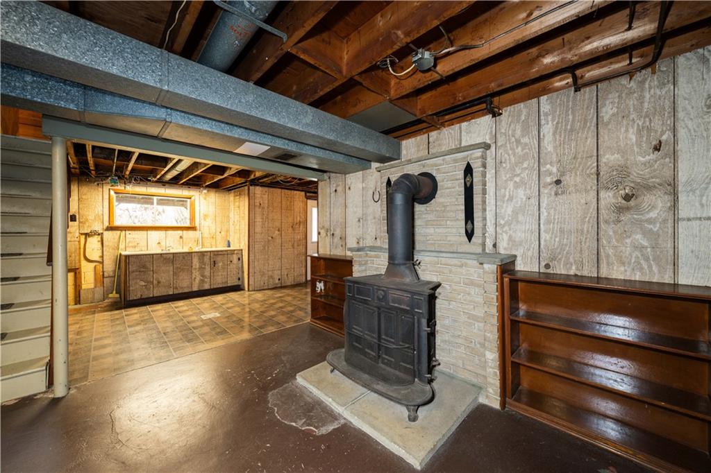 5188 Richland Road Gibsonia, PA 15044 - Photo 20 of 27 Cast-iron stove, laundry area (right of stairs).