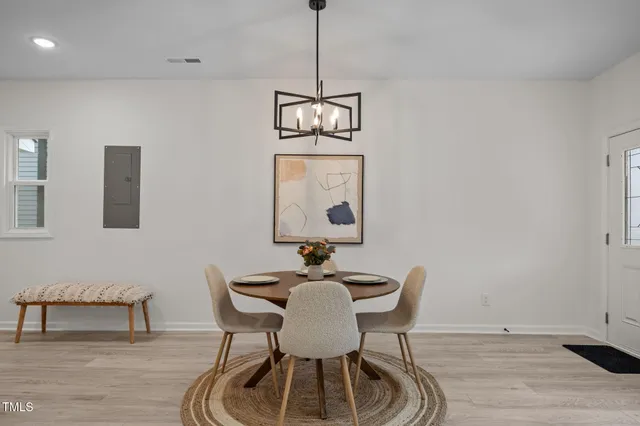 a dining room with furniture and window